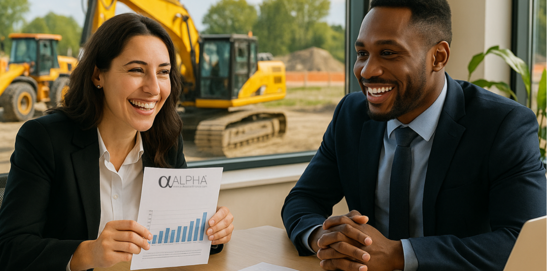 two people sat at an office desk discussing business refinance
